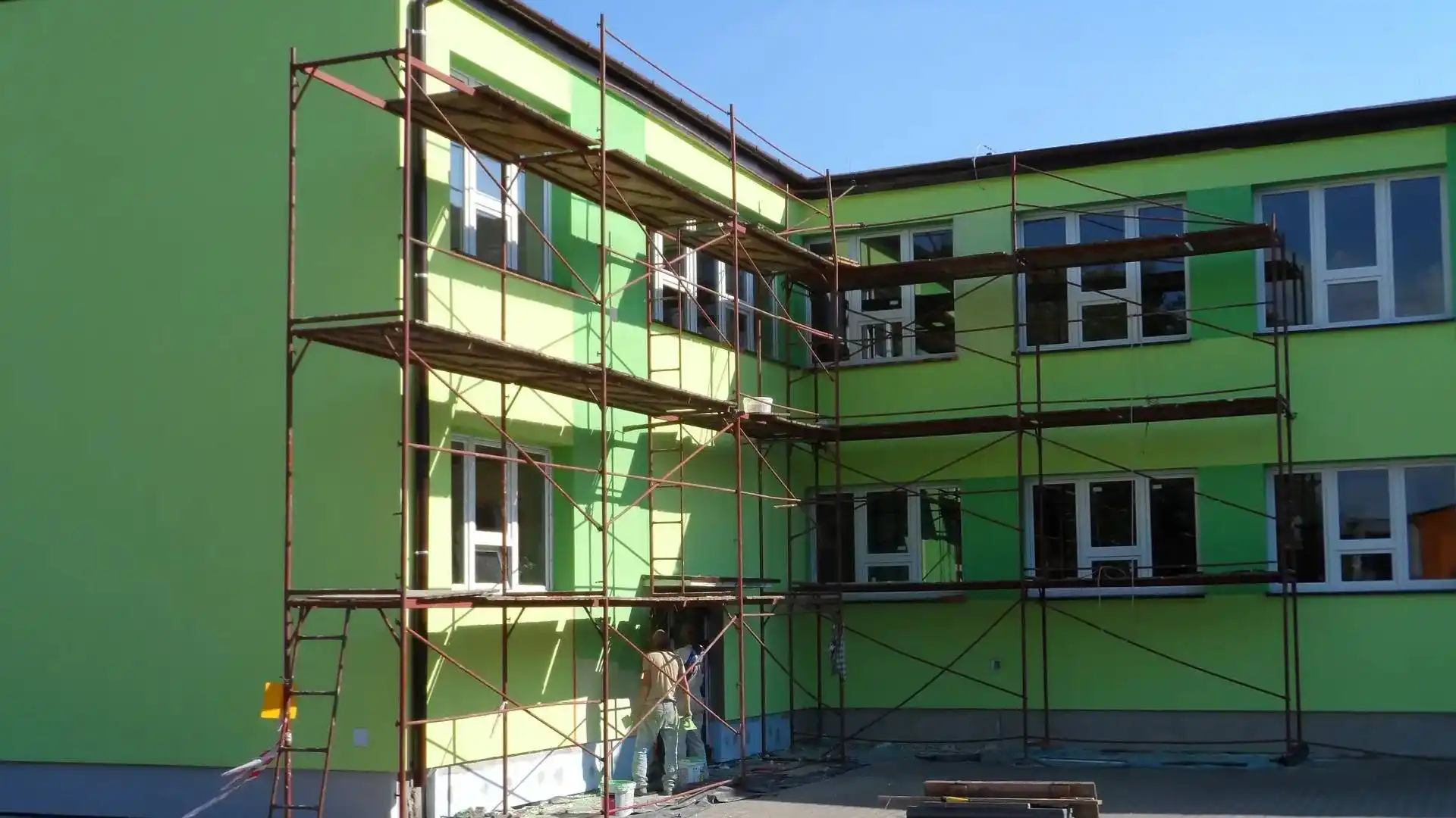 A Green mansion with scaffolds